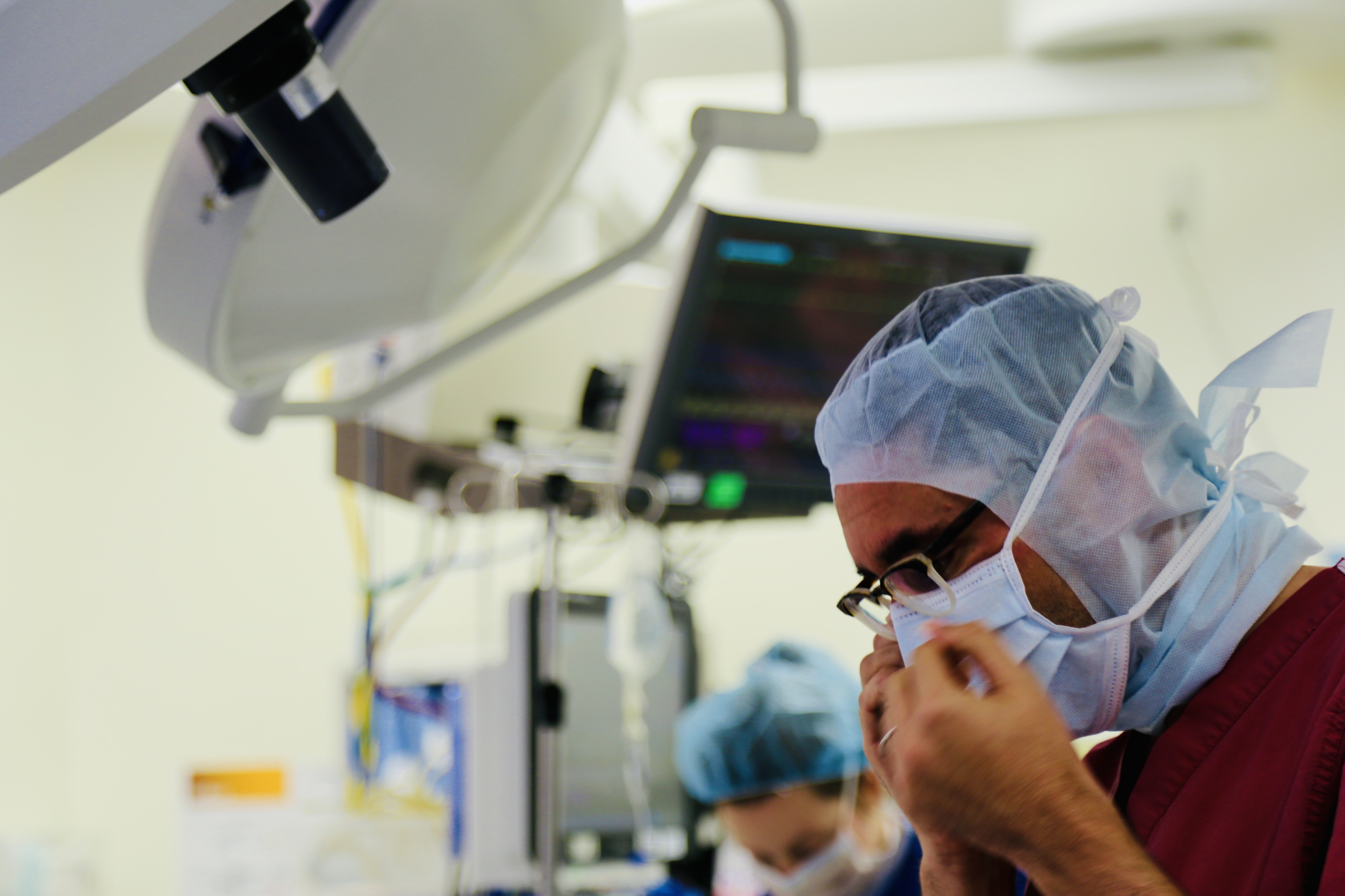 Close up of pediatric heart surgeon David Kalfa, MD, scrubbing in before surgery in the operating room.