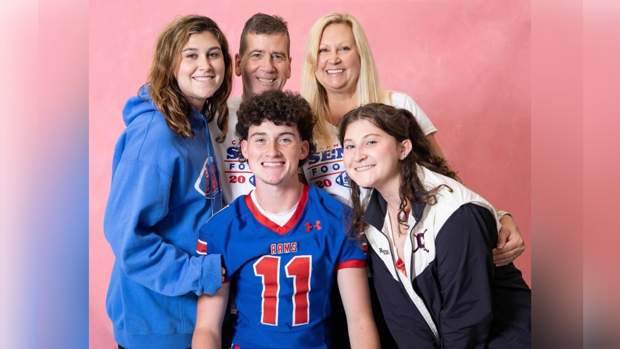 Patient, Michael, poses with his spouse and three children.