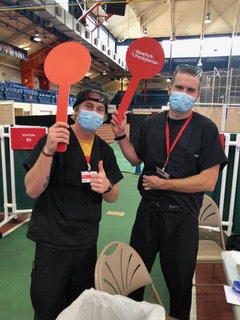 Noah Landguth and Joe Lorenz at a vaccination station.