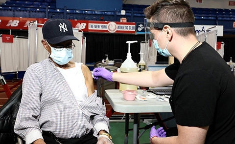 93-year-old Bronx resident, Persio Perez, was among the first to receive the vaccine at the Armory. Photo courtesy of New York-Presbyterian Hospital.