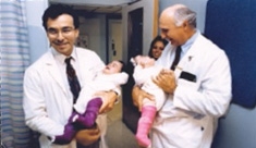 Dr. Stylianos and the late Dr. Peter Altman with the newly separated twins in 1993.